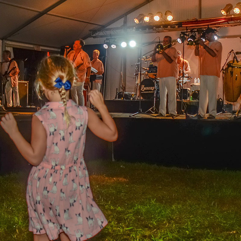 Girl Dancing to Band